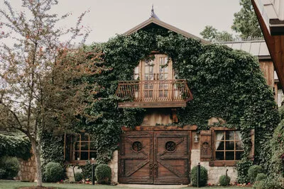 Outside view that looks like an old ivy covered European barn